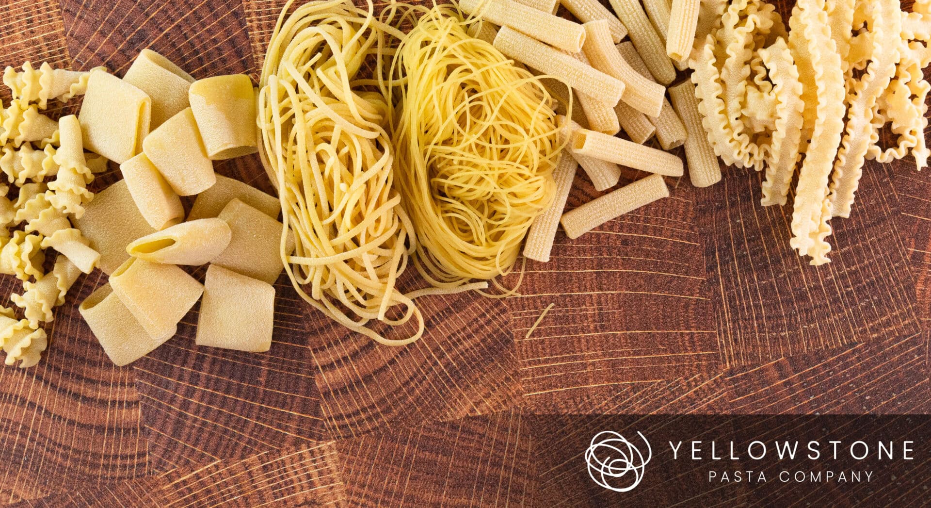 Product Photography for Yellowstone Pasta Company featuring a Variety of uncooked pasta on wooden surface