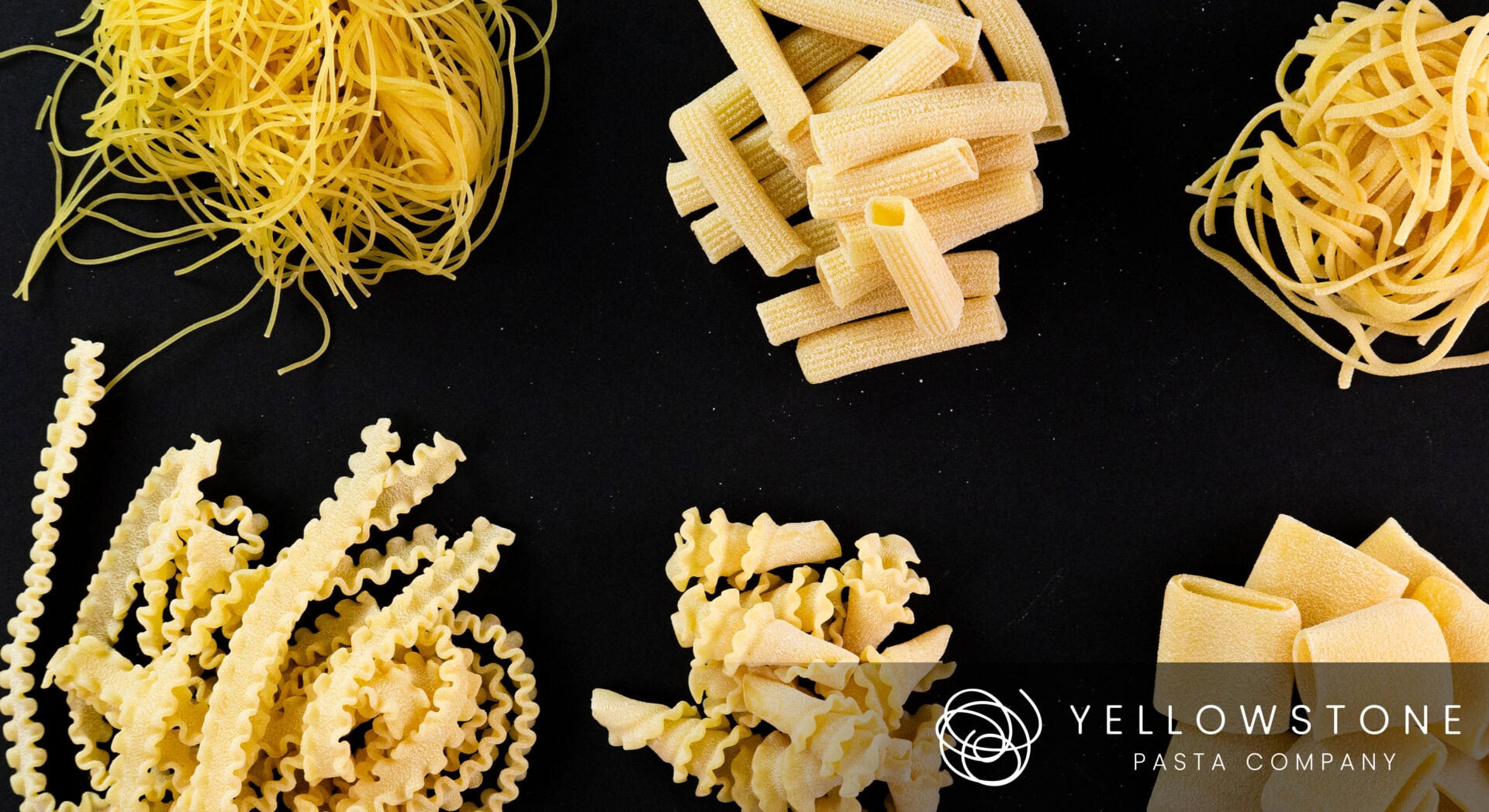 Product Photography for Yellowstone Pasta Company featuring Assorted uncooked pasta varieties on black surface